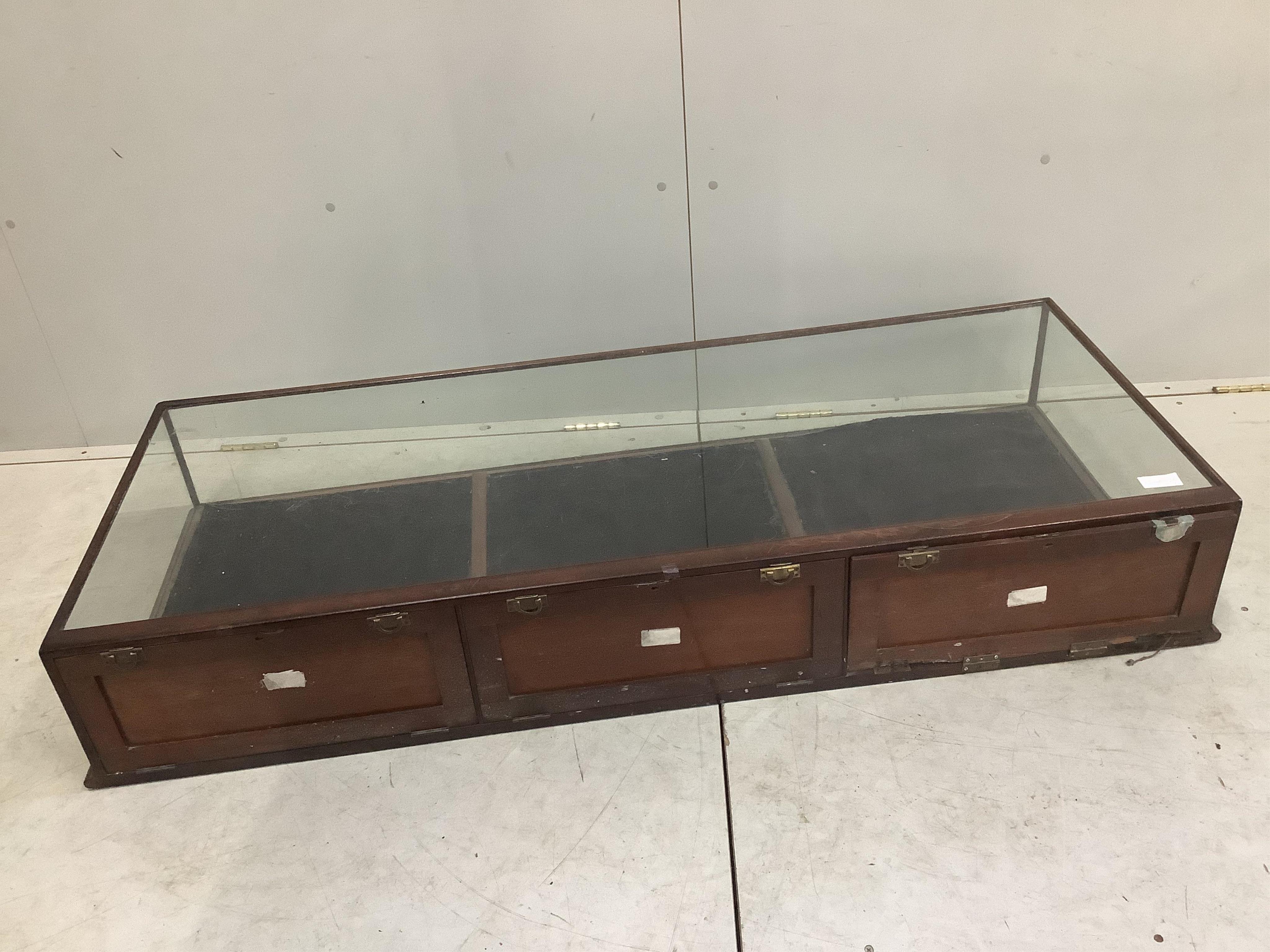 Two late 19th / early 20th century mahogany table top display cases, larger width 151cm, depth 61cm, height 25cm. Condition - poor